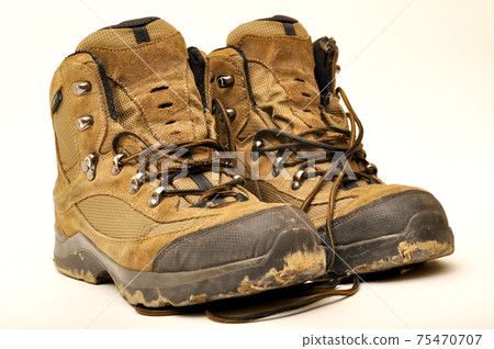 Hiking shoes and a white background, Sturdy hiking boots Hiking shoes and a white background, Sturdy hiking boots 75470707