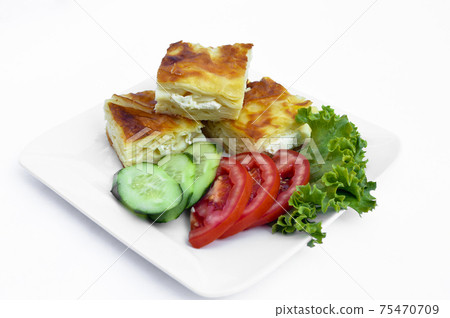 Turkish pastry with tomato and cucumber as a snack, su boregi, isolated on white background Turkish pastry with tomato and cucumber as a snack, su boregi, isolated on white background 75470709