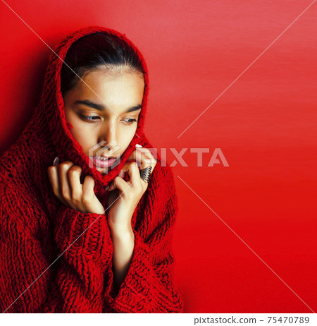 young pretty indian girl in red sweater posing emotional, fashion hipster teenage, lifestyle people concept 75470789