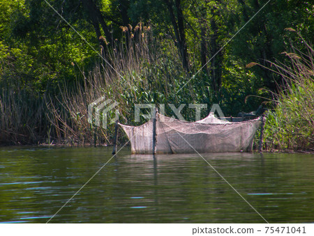 Fishing on the lake. Fishing tackle on the lake. Fishing background. Fishing on the lake. Fishing tackle on the lake. Fishing background. 75471041