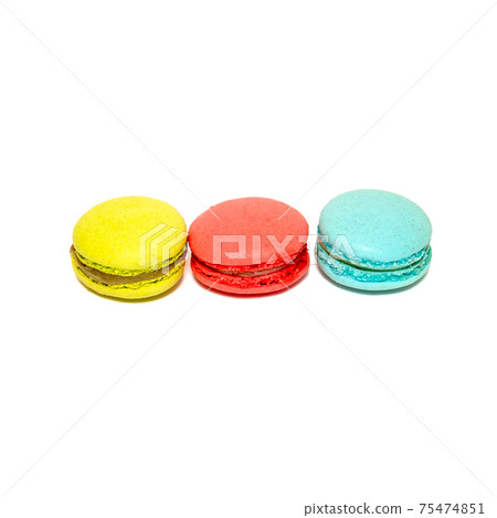 Yellow Red Blue Macaroons isolated in white background. Colorful french macarons close-up. Tasty sweet color macaroon, bakery concept 75474851
