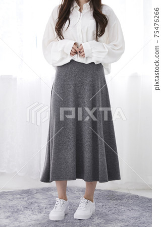 A woman in a skirt A woman in a skirt 75476266