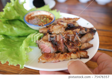 grilled beef , roasted beef or beef steak 75476357