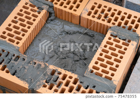 Fresh red brickwork, uncured mortar Fresh red brickwork, uncured mortar 75478355