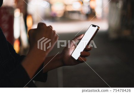 Hold your smartphone on the road Hold your smartphone on the road 75478426