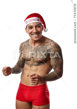 Portrait of athletic smiling tattooed guy. Studio shot, isolated Portrait of athletic smiling tattooed guy. Studio shot, isolated 75478876