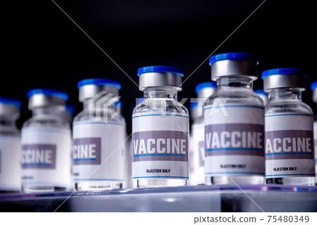 Glass vials for vaccine in laboratory. Group of vaccine bottles. Medicine in ampoules. 75480349
