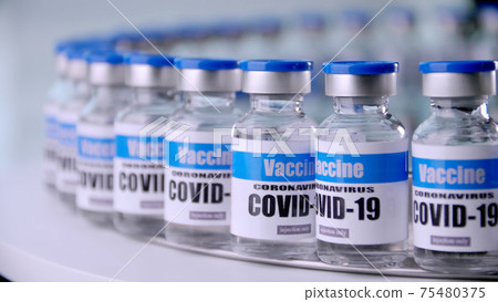 Glass vials for Covid-19 vaccine in laboratory. Group of Coronavirus vaccine bottles. Medicine in ampoules. Glass vials for Covid-19 vaccine in laboratory. Group of Coronavirus vaccine bottles. Medicine in ampoules. 75480375