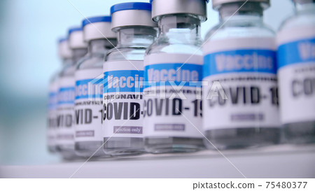 Glass vials for Covid-19 vaccine in laboratory. Group of Coronavirus vaccine bottles. Medicine in ampoules. 75480377