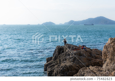 Men enjoying fishing Men enjoying fishing 75482823