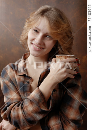 Beautiful girl with coffee mug . Beautiful girl with coffee mug . 75483943