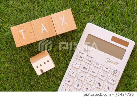 Taxes | Building blocks, calculators and coins with "TAX" written on them Taxes | Building blocks, calculators and coins with "TAX" written on them 75484726