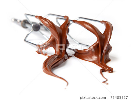 whisk whit melted chocolate cream isolated on white background, selective focus whisk whit melted chocolate cream isolated on white background, selective focus 75485527