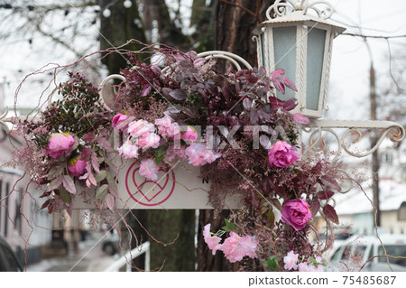 City street is decorated with artificial flowers. City street is decorated with artificial flowers. 75485687