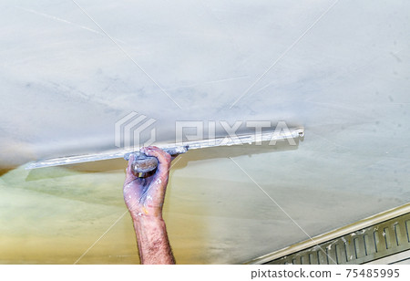 putty; filler; coating; filling; plasterer man; renovation home; architecture; builder; building; cement; concrete; development; engineering; filler; filling; finishing; foreman; gypsum; gypsum plaste putty; filler; coating; filling; plasterer man; renovation home; architecture; builder; building; cement; concrete; development; engineering; filler; filling; finishing; foreman; gypsum; gypsum plaste 75485995