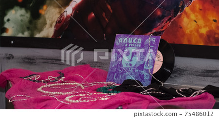 Retro Vinyl records music background near the superhero wall audio disc Retro Vinyl records music background near the superhero wall audio disc 75486012