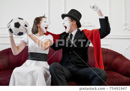 Two mime artists, football fans parody Two mime artists, football fans parody 75491947
