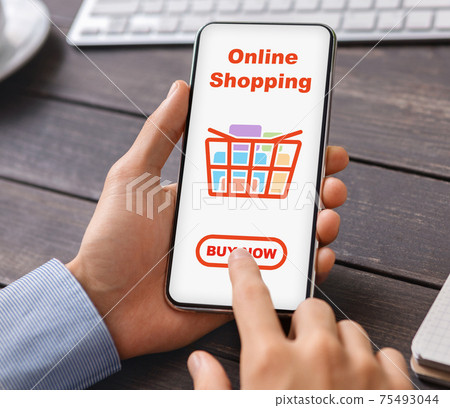 Male hands holding mobile phone with online shopping application 75493044