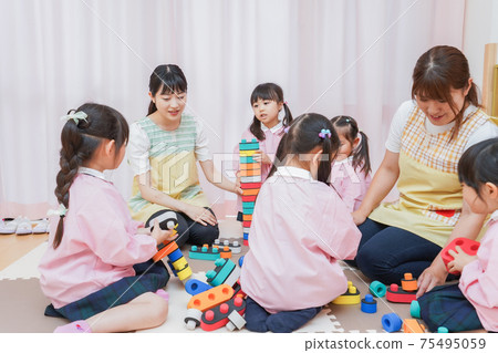 Children playing with blocks 75495059