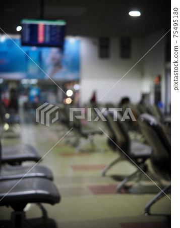 blur lonesome abandoned almost empty passenger's waiting room in front of gate in a previous tourist destination airport in COVID-19 pandemic era blur lonesome abandoned almost empty passenger's waiting room in front of gate in a previous tourist destination airport in COVID-19 pandemic era 75495180