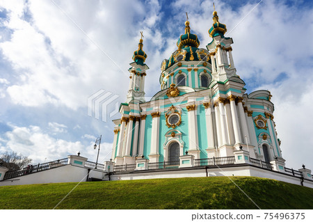 Beautiful scenic view of Saint Andrew s Church against blue sky on bright spring day in Kiev old city center. Ukrainian capital Kiyv famous podol sightseeing landmark poi Beautiful scenic view of Saint Andrew s Church against blue sky on bright spring day in Kiev old city center. Ukrainian capital Kiyv famous podol sightseeing landmark poi 75496375