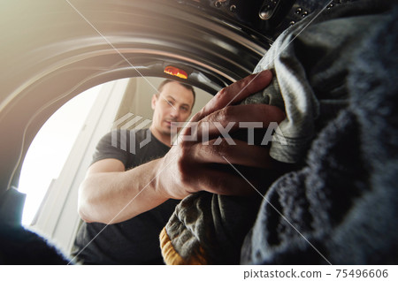 Young man doing housework Young man doing housework 75496606