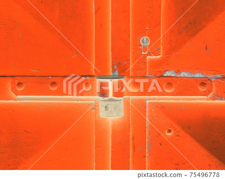 Door lock system detail. Blue industrial double door with rusty marks. 75496778