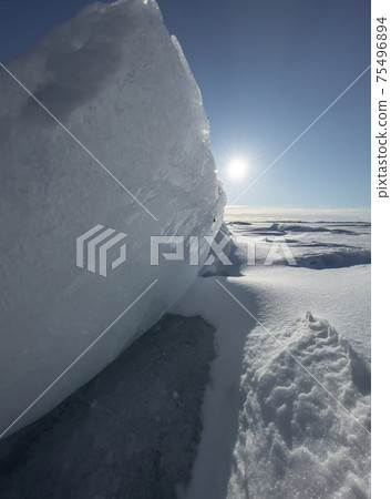 Ice slopes in sunny winter day, transparent ice of blue color, purely blue sky, long shadows, a pure snow-covered virgin soil, snow barkhans, Ice slopes in sunny winter day, transparent ice of blue color, purely blue sky, long shadows, a pure snow-covered virgin soil, snow barkhans, 75496894