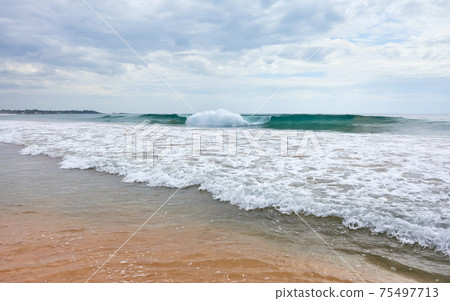 Picture of an empty tropical beach. 75497713