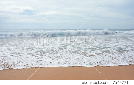 Picture of an empty tropical beach. 75497714