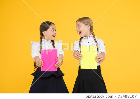 Study together. Kids cute students. Schoolgirls best friends Study together. Kids cute students. Schoolgirls best friends 75498107