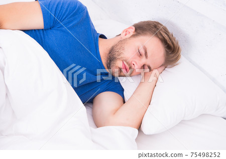 Tips sleeping better. Man handsome guy sleeping. Get Tips sleeping better. Man handsome guy sleeping. Get 75498252