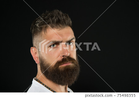 Bring more style to bearded face. Bearded man on black background. 75498355