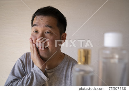 A man doing skin care A man doing skin care 75507388