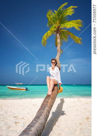 Young woman on the beach in Dominican Republic Young woman on the beach in Dominican Republic 75508977