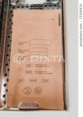 Sterilization of instruments in an autoclave, sterilized tools of a beautician. 75509419