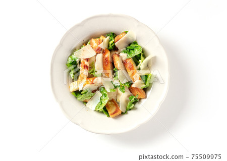 Chicken caesar salad with romaine and Parmesan cheese, overhead shot 75509975
