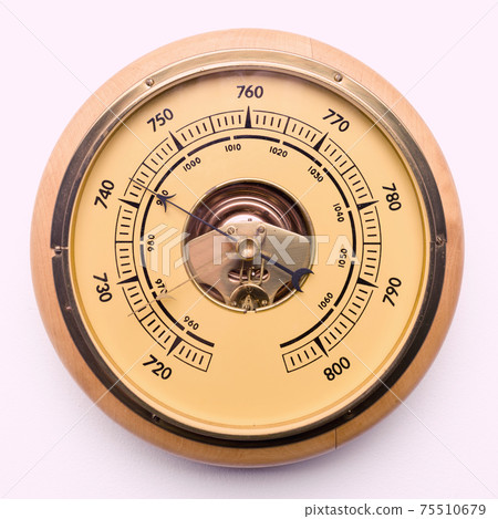Vintage style barometer isolated on white wall background Vintage style barometer isolated on white wall background 75510679