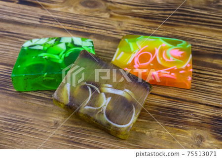 Set of handmade soap bars on wooden background Set of handmade soap bars on wooden background 75513071