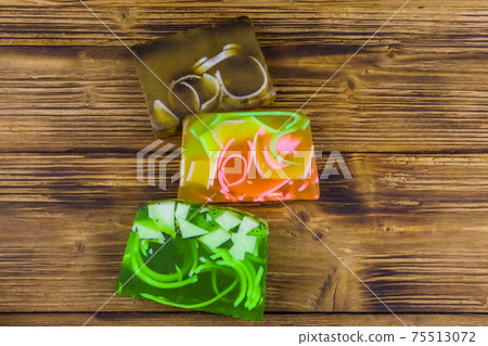 Set of handmade soap bars on wooden background. Top view Set of handmade soap bars on wooden background. Top view 75513072
