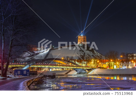 Vilnius, Lithuania - January 25, 2021: Vilnius main symbol, Gediminas castle illuminated for 698 city birthday celebrations 75513968