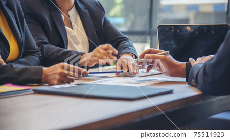 Success collaboration partners sign contract and shake hands after success business joint venture deal. Diversity Businessman shake hands together in a meeting. Trustworthy meeting business concept. 75514923