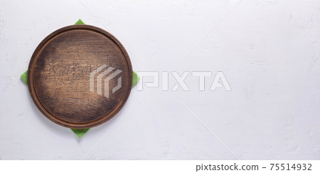 Pizza or bread cutting board for homemade baking on table. Food recipe concept at stone background Pizza or bread cutting board for homemade baking on table. Food recipe concept at stone background 75514932