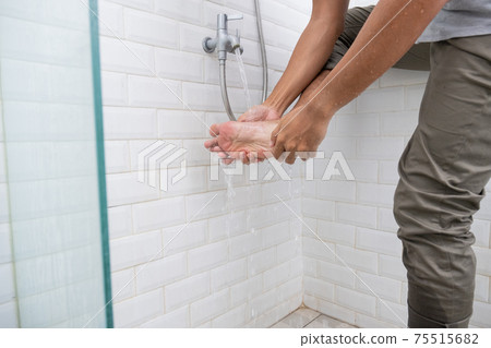 close up of man's foot perform ablution wudhu close up of man's foot perform ablution wudhu 75515682