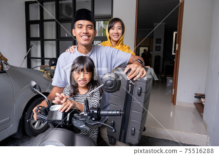 asian muslim family riding motorbike scooter together traveling with kid 75516288