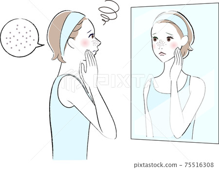 A woman looking in the mirror who is worried about pores 75516308