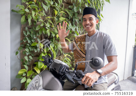muslim male going to the mosque by riding motorbike muslim male going to the mosque by riding motorbike 75516319