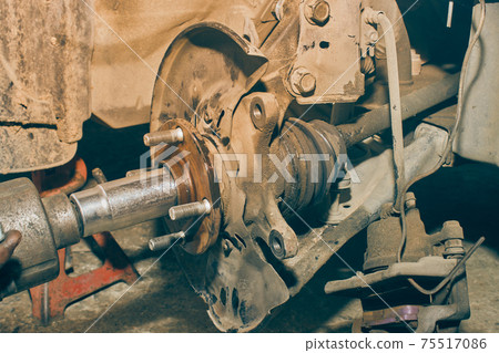 Car Mechanic or Auto Mechanic Tighten Drive Axle Shaft Hub Nut by Wind Block in Vintage Tone Car Mechanic or Auto Mechanic Tighten Drive Axle Shaft Hub Nut by Wind Block in Vintage Tone 75517086