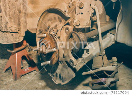 Car Wheel Hub and Drive Axle Shaft and Shock Absorber and Brake Caliper in Vintage Tone Car Wheel Hub and Drive Axle Shaft and Shock Absorber and Brake Caliper in Vintage Tone 75517094