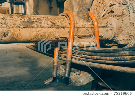 Front View Orange U-Bolt with Bump Stop on Rear Axle and Leaf Spring in Vintage Tone Front View Orange U-Bolt with Bump Stop on Rear Axle and Leaf Spring in Vintage Tone 75519666